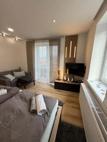 Plně vybavený krásný apartmán 1kk s balkonem, výhledem