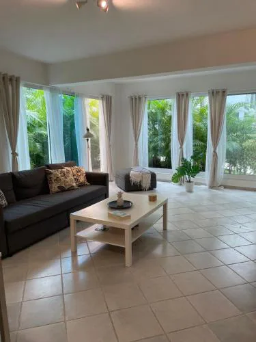 White haven surrounded by tropical gardens, pools