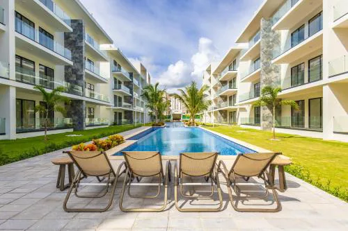 2BR Tropical Escape - Private Terrace, BBQ, Pool, Walk to Beach
