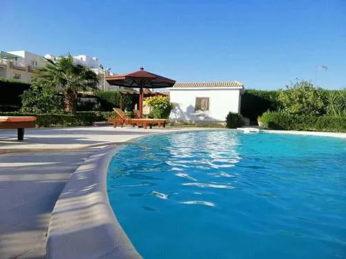 One room in a compound with the swimming pool