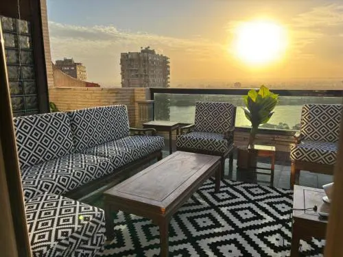 Exclusive 3BR Rooftop Retreat Nile and Pyramids Views Maadi Prime location