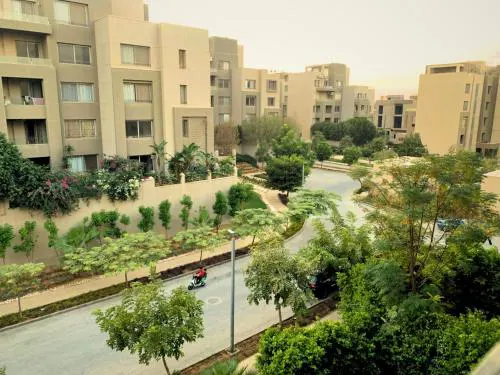 In Palm Hills Village Gate New Cairo Compound Faced AUC