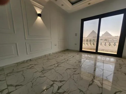 Prime Location Apartment with Unobstructed Giza Pyramids View & Easy City Access