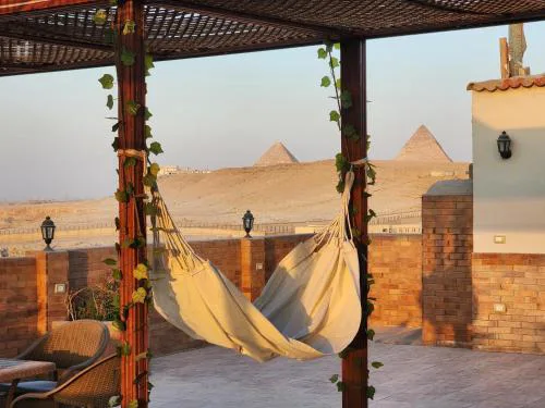 Private rooftop with jacuzzi and pyramids view