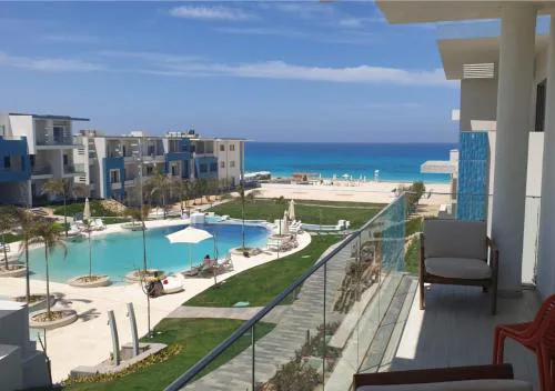 Fouka Bay North Coast 2BRs Modern Style Serviced Apartment with Open Pool & Sea View