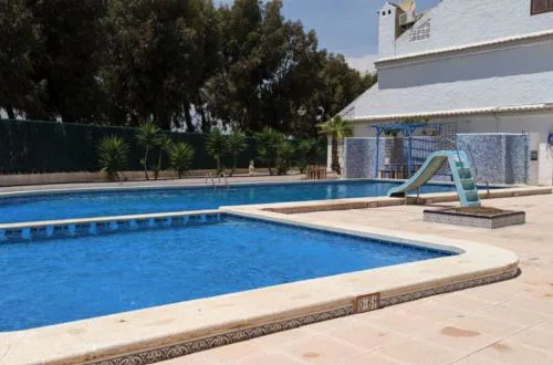 Charming 3-Bedroom House with Shared Pool in Punta Prima, Torrevieja