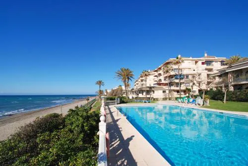 Beachfront Apartment with Pool, Padel & Private Parking