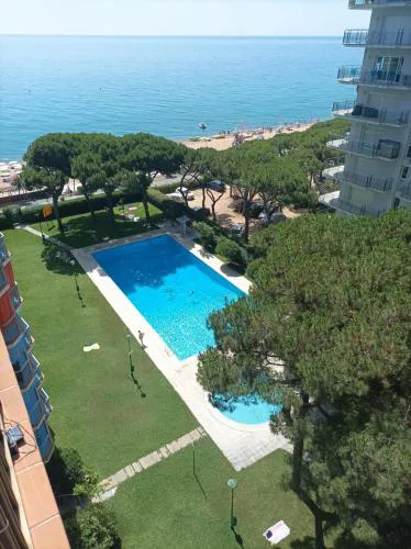 Bright Apartment with Two Balconies and a Seaside Pool