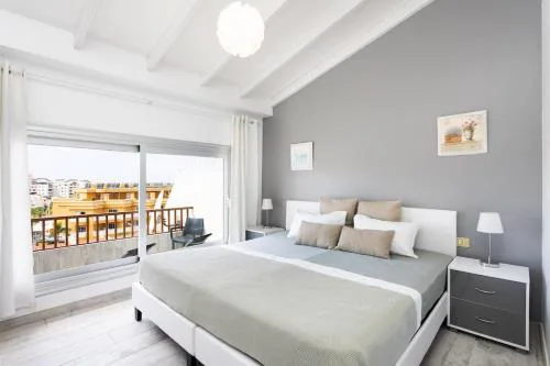 Bright & Elegant Duplex with Terrace and Pool, Just Steps from Puerto Colón