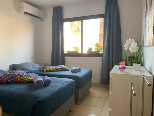 Bedroom with shared bathroom and swimming pool