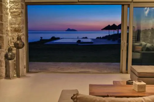 Beachfront villa Komos with heated pool