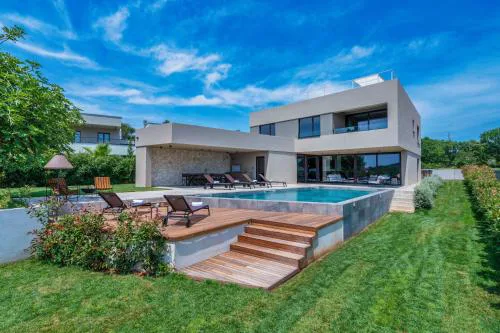 Luxury beachside villa with a pool and a sea view