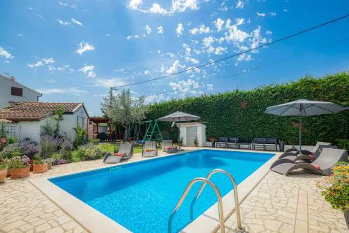 Holiday House with Pool & Grill
