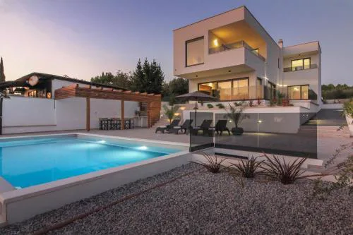 New modern luxury villa near the beach with sea view, pool, sauna , BBQ and playground by WiiBuk