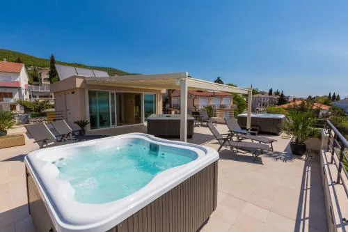 Faszienierendes Apartment nur 100 Meter zum Strand mit Jacuzzi, Sauna, Meerblick