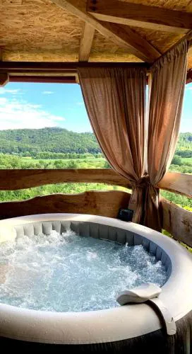 Holiday home with hot tube, near the river