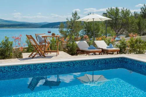 Seafront Villa Noah with heated pool