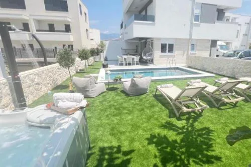 Family friendly apartments with a swimming pool Novalja, Pag - 23489