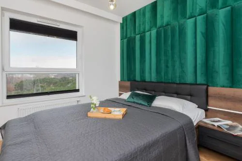 9th Floor Green and Grey Apartment in Gdańsk Brzeźno with Two Bedrooms and Parking by Noclegi Renters