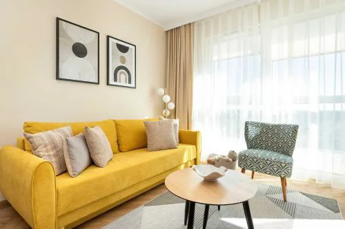 Sunny Apartment with Parking near Polsat Plus Arena by Noclegi Renters