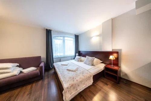 Pokoje i apartamenty ,,Leśne"