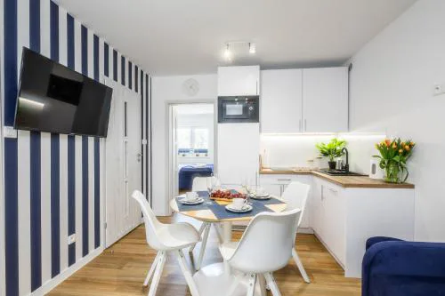 Apartament 1B Niebieskie Apartamenty Poddąbie z basenem krytym, odkrytym, salą zabaw, animacjami