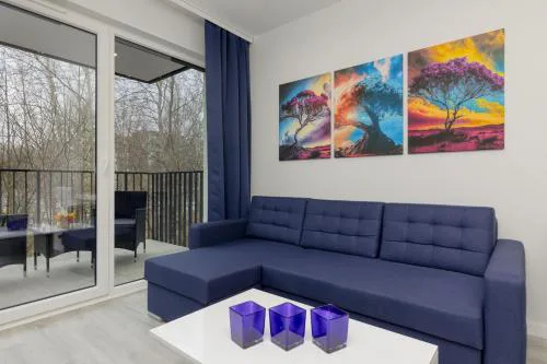 Dark Blue and Grey Apartment with Pastel Bedroom in Warsaw by Noclegi Renters