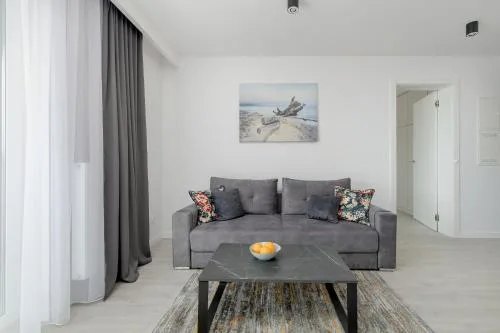 Modern Apartment with Balcony and Parking by Noclegi Renters
