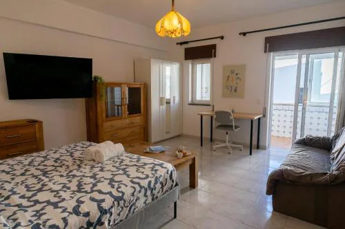 Large room with private lounge area, work space and balcony