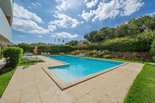 Sunlit Poolside Retreat w/ Balcony by HostWise