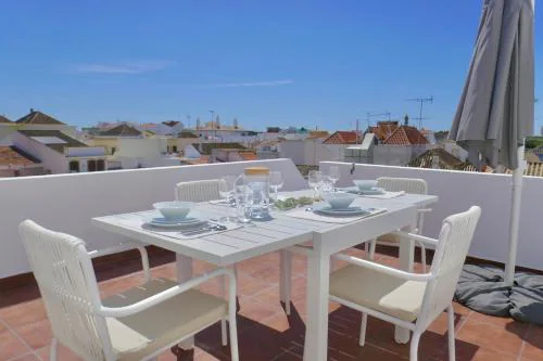 Escape to a terrace over Tavira's history