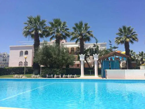 Small cozy flat, by the pool and by the sea.