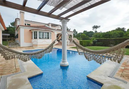 Noble beach villa with private garden and pool