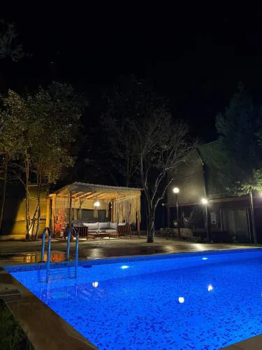 Detached villa with a heated pool and garden